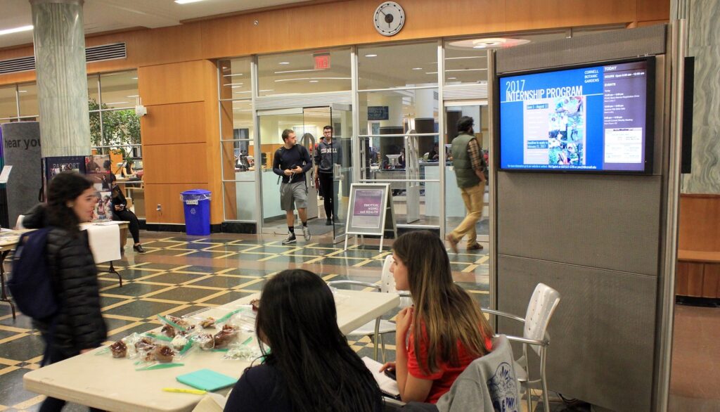 Lobby kiosk LCD and students tabling