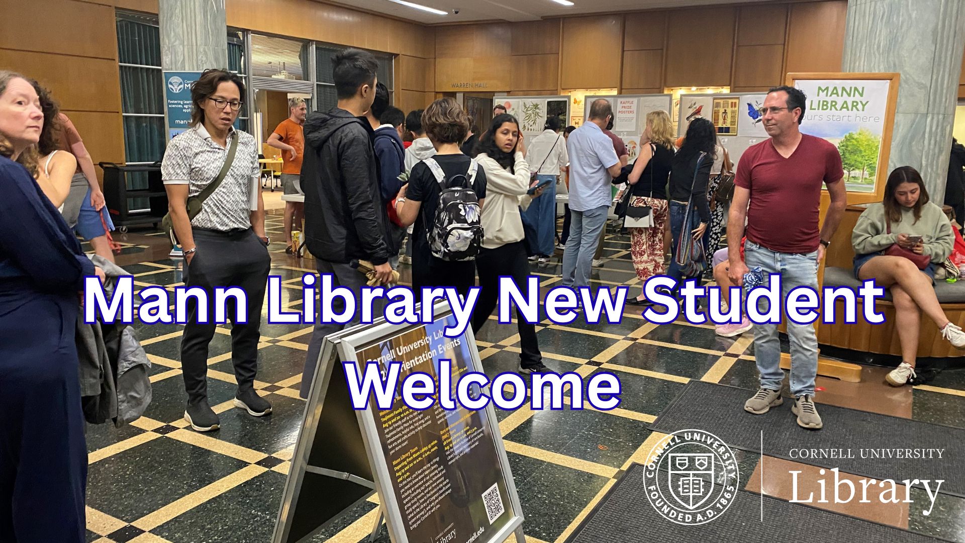 Students and families gather in the Mann Library lobby during New Student Orientation, with text reading ‘Mann Library New Student Welcome.’