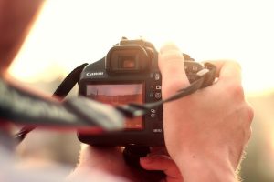 photographer with dslr camera